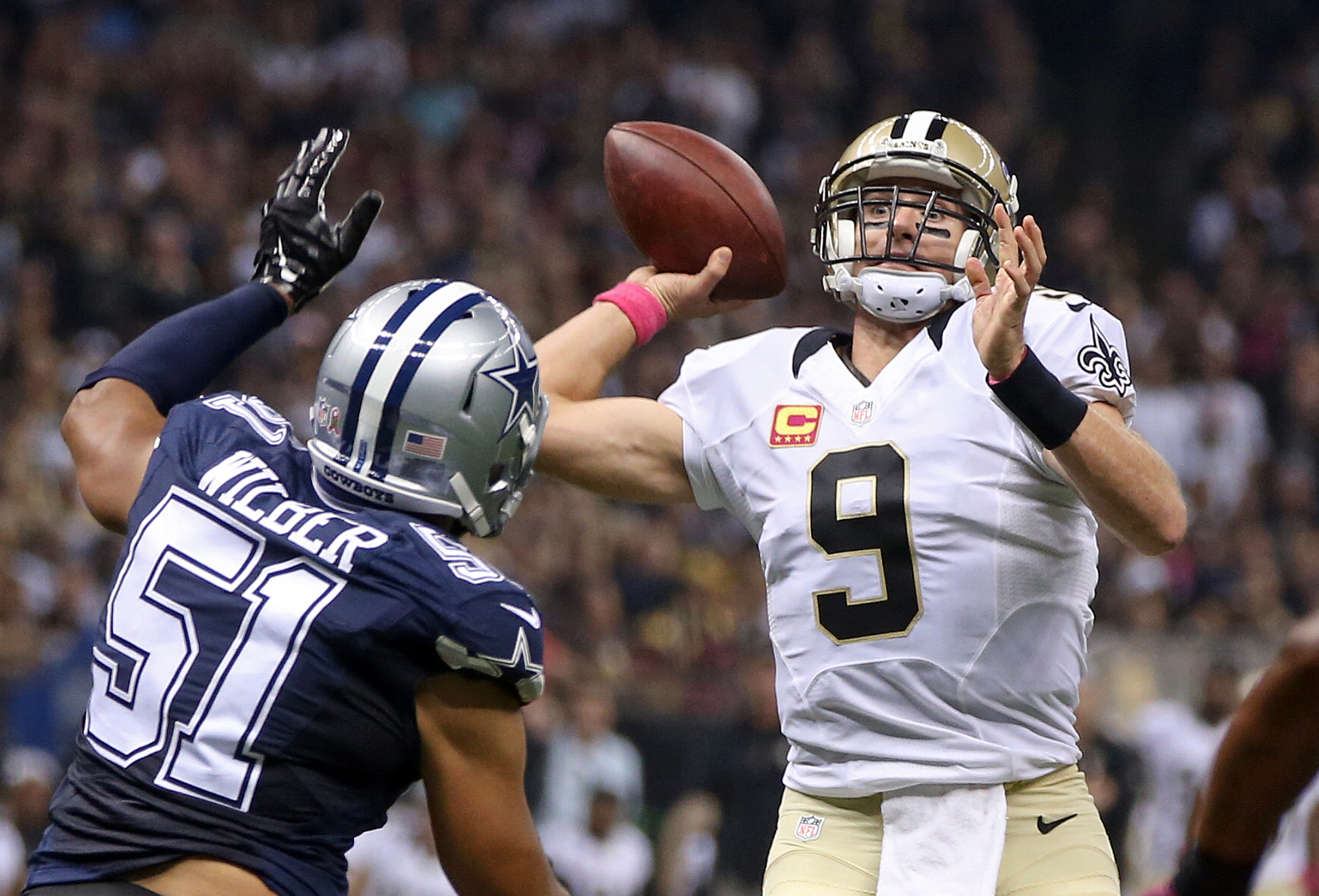 24 January 2010: Saints quarterback Drew Brees (9) holds up the