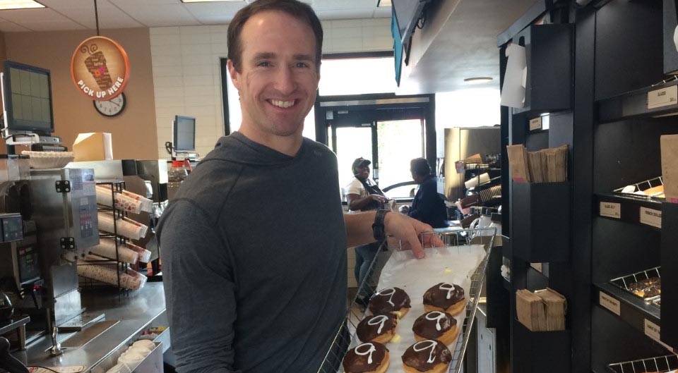 The Game Isn't Over: Athletes and The Entrepreneurial Path Drew Brees, the legendary quarterback, at one of his many Dunkin' Donuts franchises.