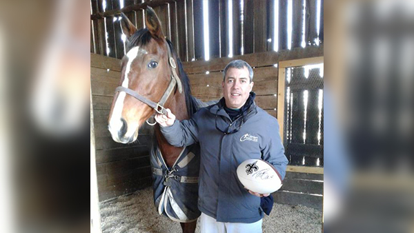 Horse surgeon given football autographed by Drew Brees 